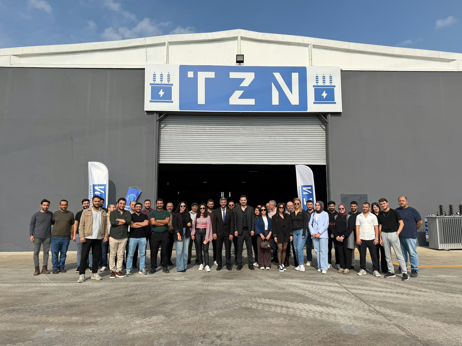 Mersin Chamber of Electrical Engineers members and the TZN Trafo team outside the factory